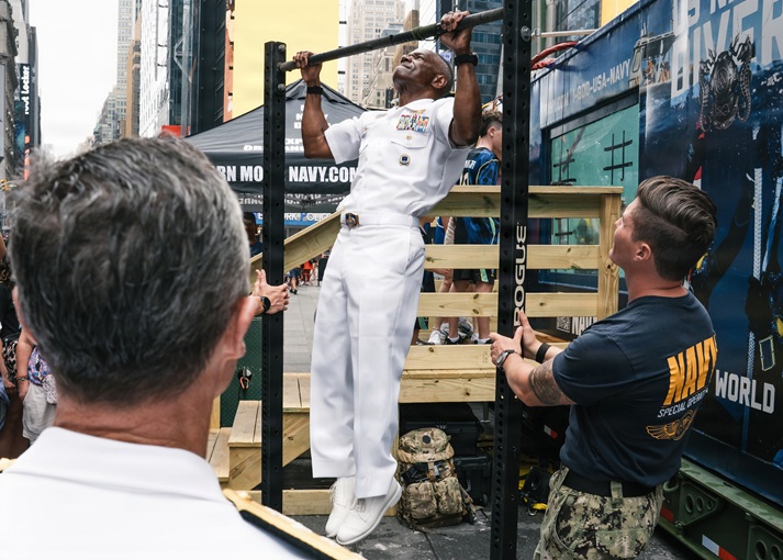Rear Adm. Darryl Walker doing pull ups