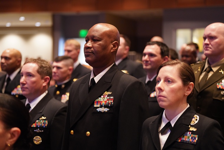 Students attending the U.S. Naval War College (NWC) stand at attention during the college’s spring graduation ceremony onboard Naval Station Newport, R.I., March 5, 2025.