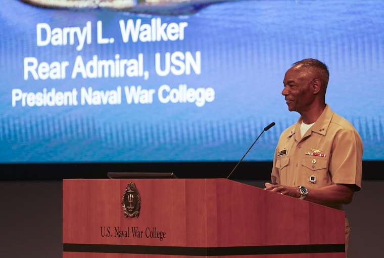 Rear Adm. Walker at a podium
