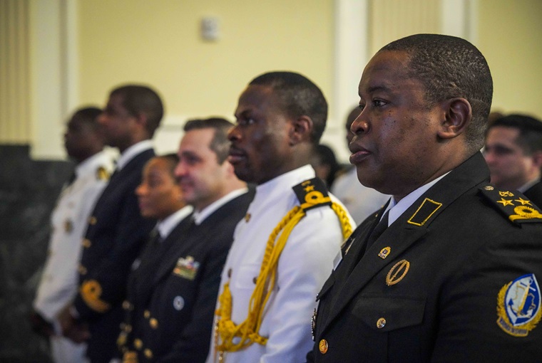Students attending the Maritime Security and Governance Staff Course (MSGSC) at the U.S. Naval War College (NWC) stand at attention during a graduation ceremony onboard Naval Station Newport, Feb. 28, 2025.