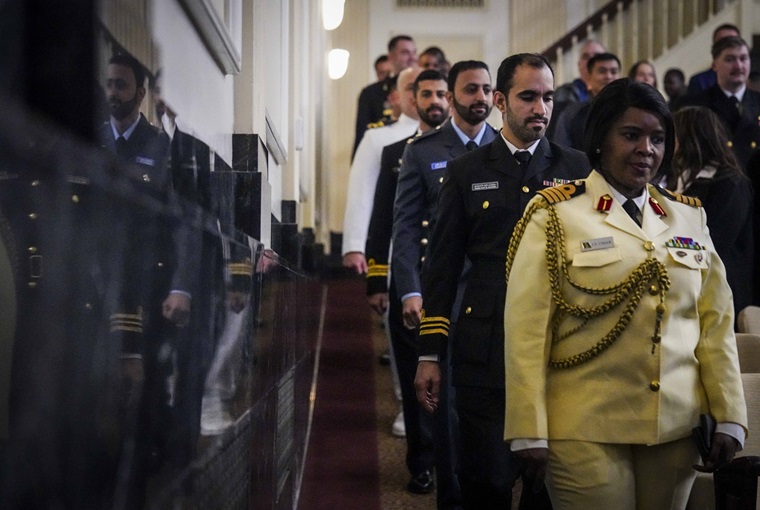 Students attending the Maritime Security and Governance Staff Course (MSGSC) at the U.S. Naval War College (NWC) arrive to their graduation ceremony onboard Naval Station Newport, Feb. 28, 2025.