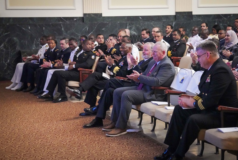 Staff and faculty of the U.S. Naval War College (NWC) applaud students attending the Maritime Security and Governance Staff Course (MSGSC) during their graduation ceremony onboard Naval Station Newport, Feb. 28, 2025.