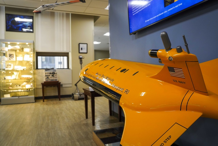 The Manta Test Vehicle, an underwater unmanned vehicle prototype designed by the Naval Undersea Warfare Center, sits on display with other unmanned systems prototypes at the U.S. Naval War College (NWC) following a demonstration conducted by Seasats, a U.S.-based developer of autonomous maritime systems, and the U.S. Naval War College (NWC) onboard Naval Station Newport, Rhode Island, July 25, 2025.