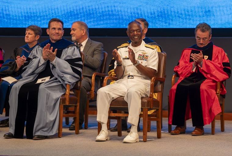 A group of seated people clapping
