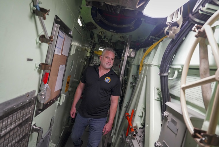 Dr. Mark de Jong, a faculty member and director of the Newport, Rhode Island,-based U.S. Naval War College’s (NWC) Henry E. Eccles Library, navigates a passageway onboard the Virginia-class fast-attack submarine USS Delaware (SSN 791) on Naval Submarine Base New London, Connecticut, Aug. 1, 2025.