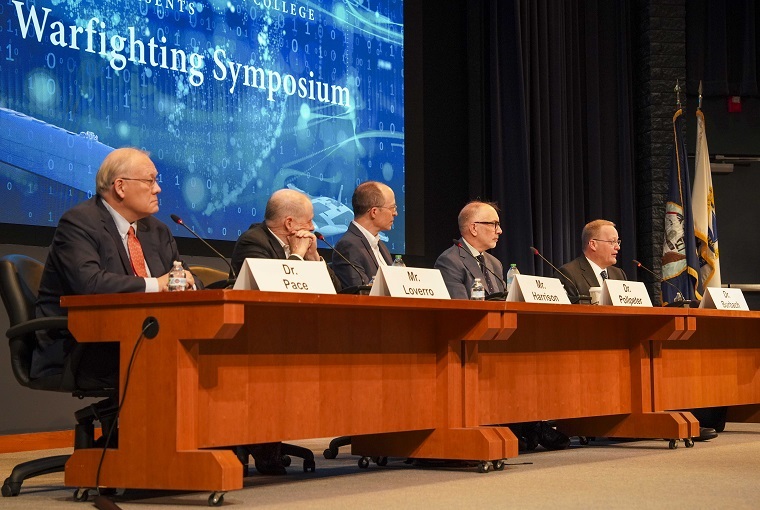 Panelists hold a discussion at the U.S. Naval War College (NWC) Future Warfighting Symposium (FWS) during a tour onboard Delaware ononboard Naval Station Newport, Aug. 7, 2025.