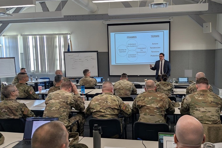 Lt. Col. Noble Wonsetler, U.S. Army, and Associate Prof. Matthew Tackett from the U.S. Naval War College’s Joint Military Operations (JMO) faculty joined the leadership at Camp Edwards-Garrison Training Site – Col. Jeff Arleque and Command Sergeant Major Michael Covel – for a professional development workshop on Joint Base Cape Cod, Massachusetts, on Dec. 5, 2025.