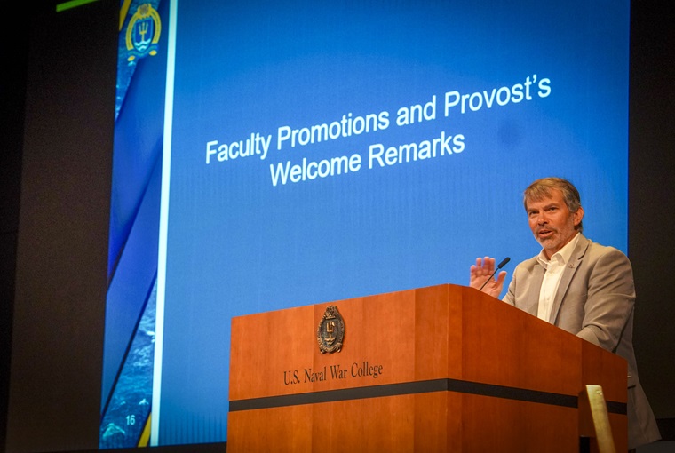 U.S. Naval War College (NWC) Provost Stephen Mariano, Ph.D, addresses new and returning faculty and staff during the 18th annual NWC Cloister ceremony onboard Naval Station Newport, Rhode Island, Aug. 4, 2025.