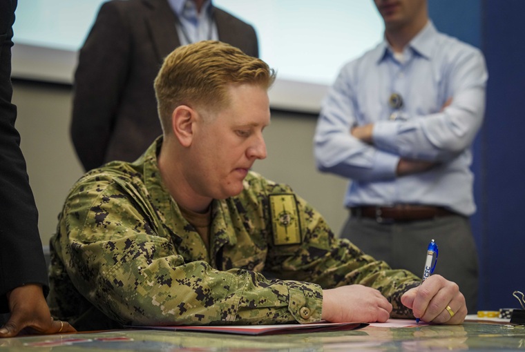 A student participating in the war game