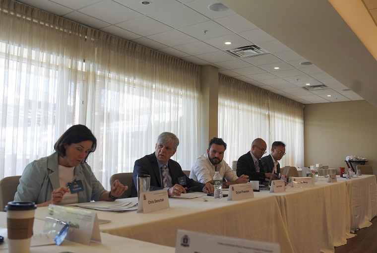 A group of people at a conference 