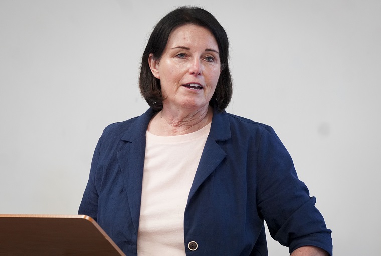 A woman speaking at a podium
