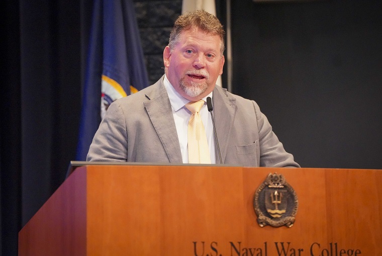 A man speaking at a podium
