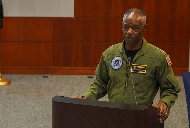 A man speaking at a podium