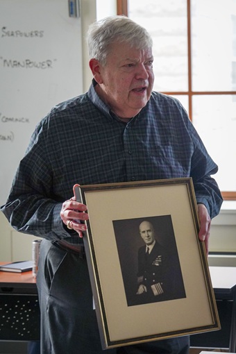 A man holding a photo