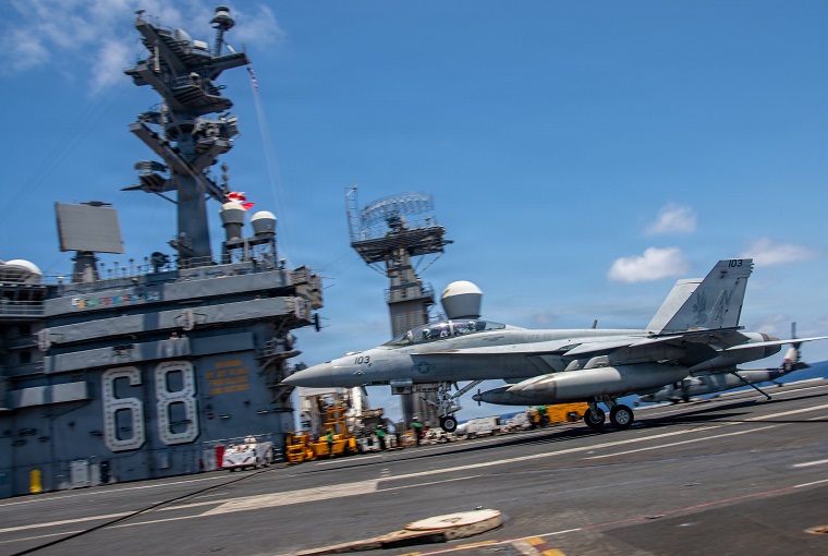 A plane on a carrier ship