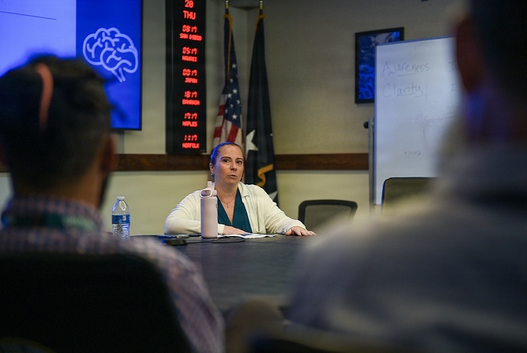 A woman at a conference table