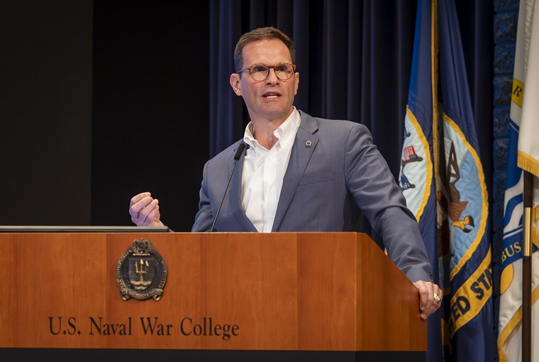 A man speaking at a podium