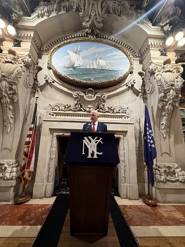 A man speaking at a podium