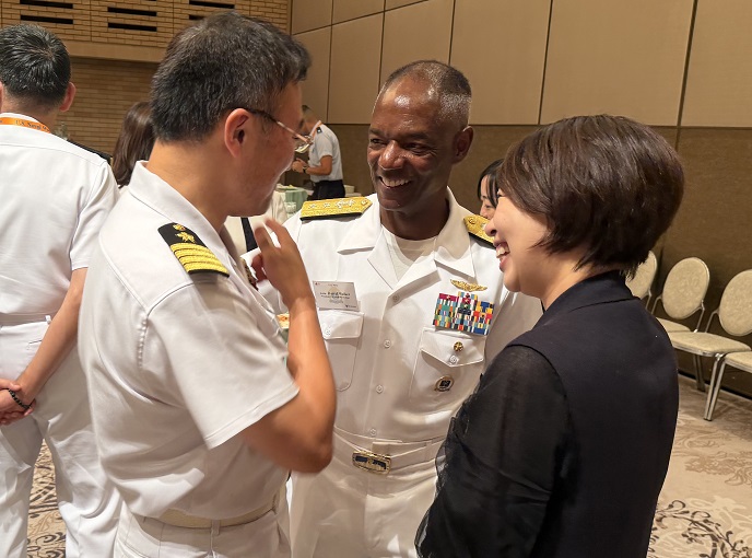 Two men and a woman talking