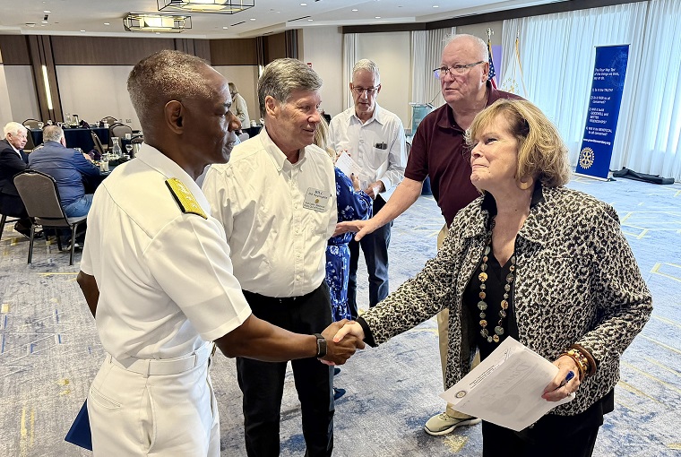 A man and woman shaking hands