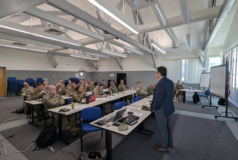 Lt. Col. Noble Wonsetler, U.S. Army, and Associate Prof. Matthew Tackett from the U.S. Naval War College’s Joint Military Operations (JMO) faculty joined the leadership at Camp Edwards-Garrison Training Site – Col. Jeff Arleque and Command Sergeant Major Michael Covel – for a professional development workshop on Joint Base Cape Cod, Massachusetts, on Dec. 5, 2025.