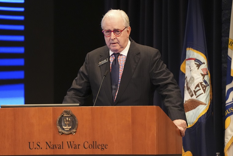 A man speaking at a podium