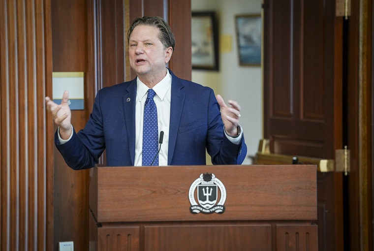 A man speaking at a podium