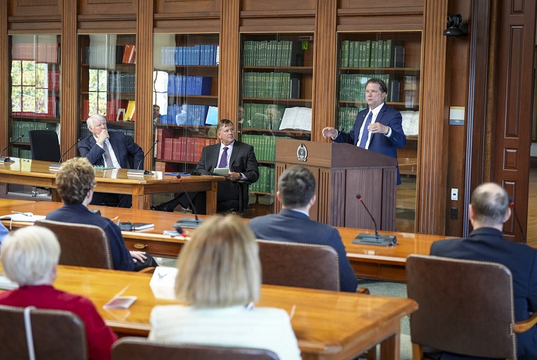A man speaking to a group of people