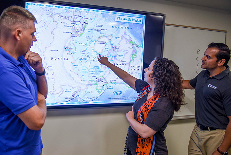 Lt. Col. Michael Zimmerman, Staff Judge Advocate, Marine Forces Europe and Africa, Gaelle Rivard Piche, Strategic Analyst with the Royal Canadian Navy, and associate professor Walter Berbrick, founding director of the Arctic Studies Group at the U.S. Naval War College.