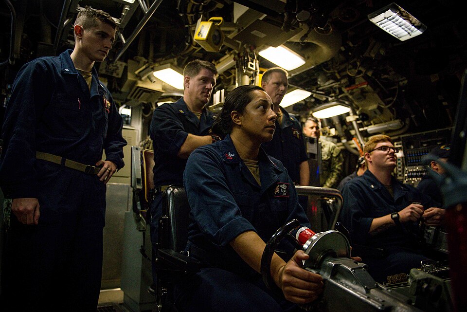 Sailors aboard the Ohio-class fleet guided-missile submarine USS Florida (SSGN 728) man the helm as the submarine dives in the Mediterranean Sea Aug. 26, 2019.
