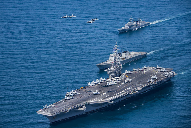 F/A-18 Hornets and Super Hornets from Carrier Air Wing (CVW) Two fly over the Republic of Korea destroyers Sejong the Great (DDG 991) and Yang Manchun (DDH 973) and Nimitz-class aircraft carrier USS Carl Vinson (CVN 70) as they transit the Western Pacific.