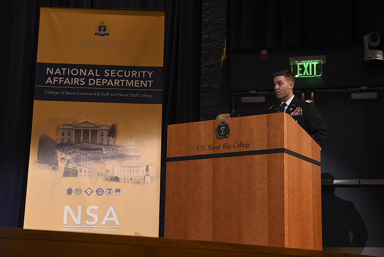 Army Maj. Joshua Koncar, a U.S. Naval War College student in the National Security Affairs department participates in the Theater Security Decision Making Final Exercise in the college's Spruance auditorium.