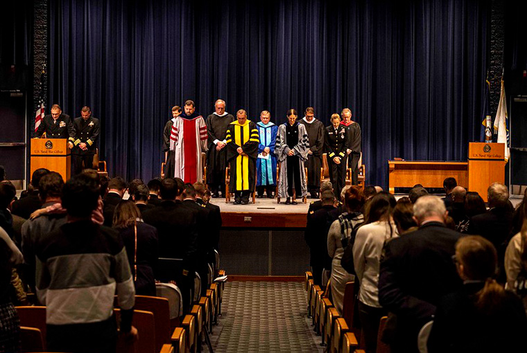 Cmdr. Robert Nelson, chaplain, gives the benediction during a U.S. Naval War College graduation ceremony, March 3.