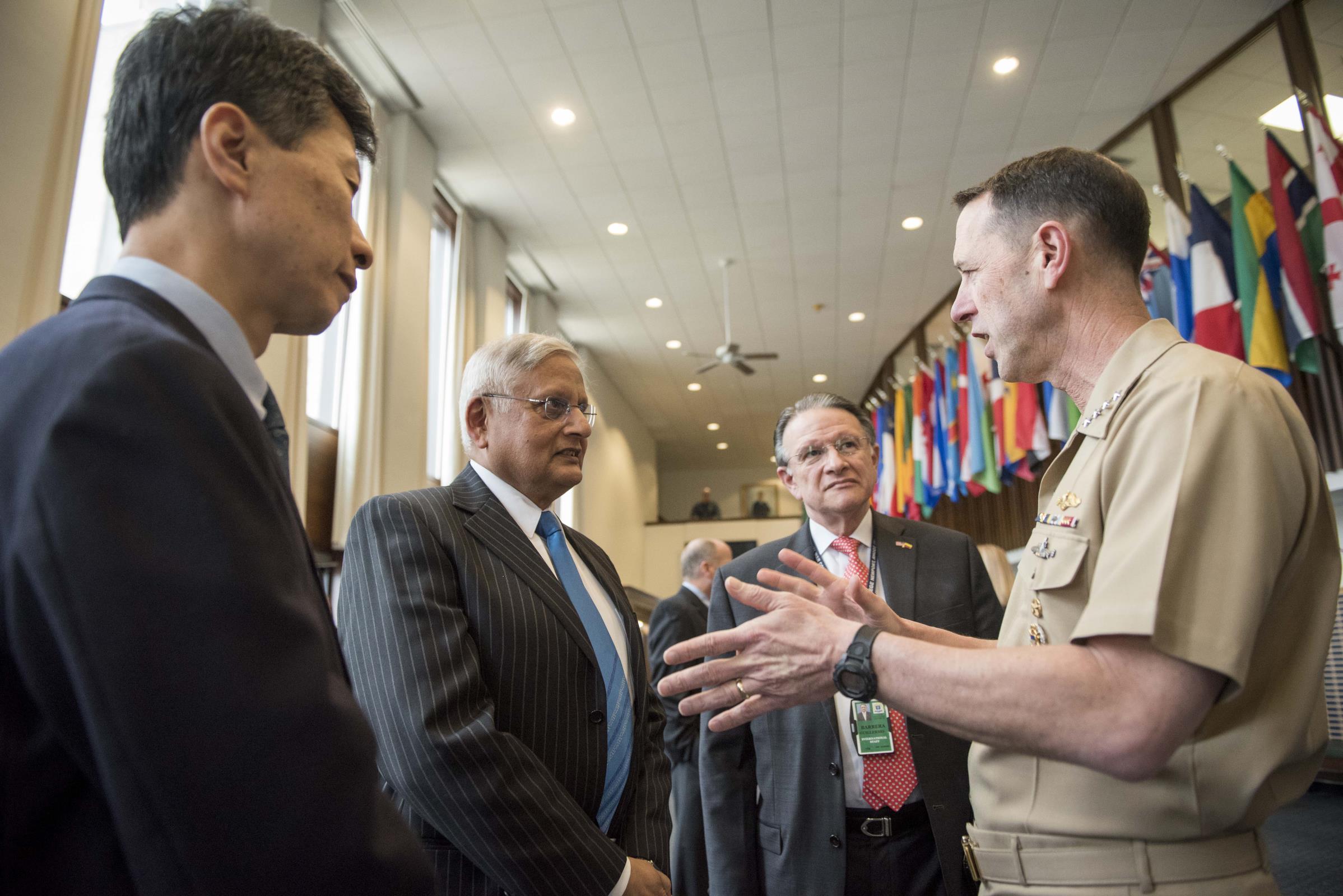 180406-N-AT895-190 NEWPORT R.I. (April 6, 2018) Chief of Naval Operations Adm. John Richardson talks with U.S. Naval War College (NWC) international staff members following the formal announcement of the formation of the College of Leadership and Ethics at U.S. Naval War College. Richardson visited the NWC to formally announce the college and to rollout the Navy Leader Development Framework 2.0. (U.S. Navy photo by Mass Communication Specialist 1st Class Nathan Laird/Released)