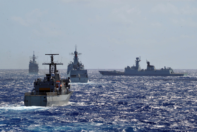 Photo of U.S. Navy Ticonderoga-class guided missile cruiser USS Port Royal (CG 73), the Mexican Navy patrol-vessel ARM Revolution (P 164), the People’s Liberation Army (Navy) frigate Yueyang (FF 575) and destroyer PLA(N) Haikou (DD 171) move into a multi-ship formation during Rim of the Pacific (RIMPAC) Exercise 2014.