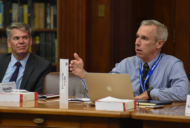 Photo of professor Michael Schmitt discussing the Second Geneva Convention during a legal conference held at the U.S. Naval War College
