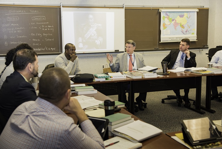 Adm. Guillermo E. Barrera teaching a class.