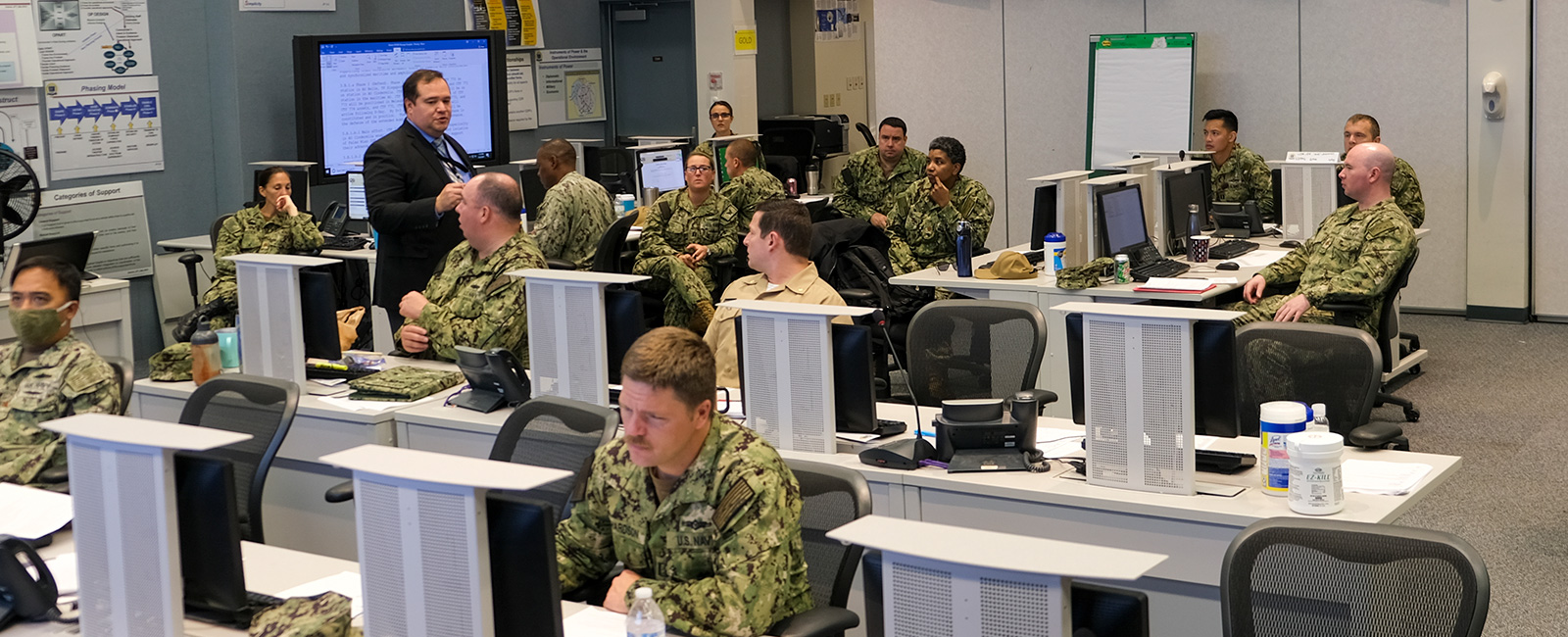 Students in the Maritime Staff Operators Course at the U.S. Naval War College listen to a lecture.