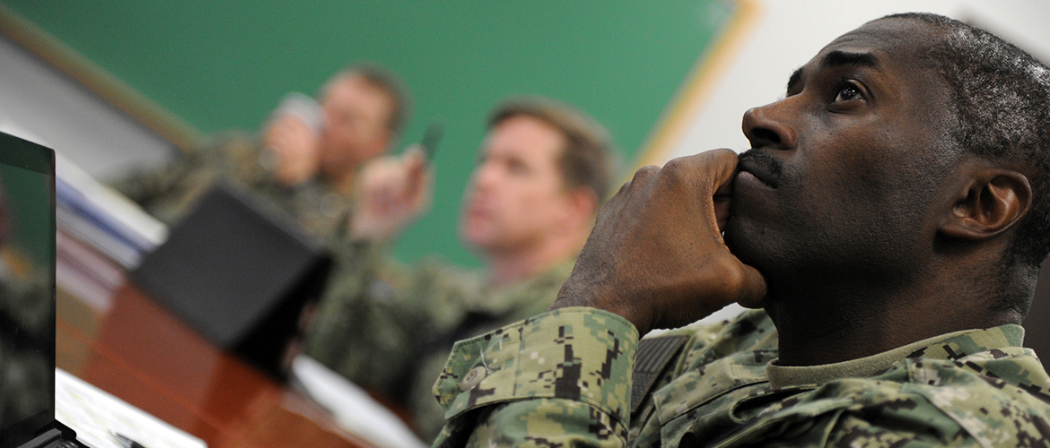 Cmdr. Hiram Weedon, a student attending U.S. Naval War College (NWC) in Newport, R.I., participates in a National Security Decision Making seminar as part of his resident curriculum requirements.