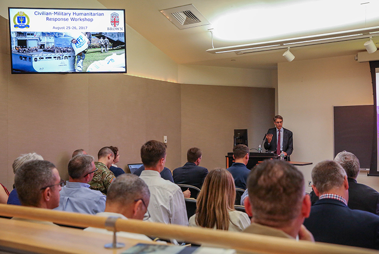 People in classroom listening to speaker at the Civilian-Military Humanitarian Response Workshop