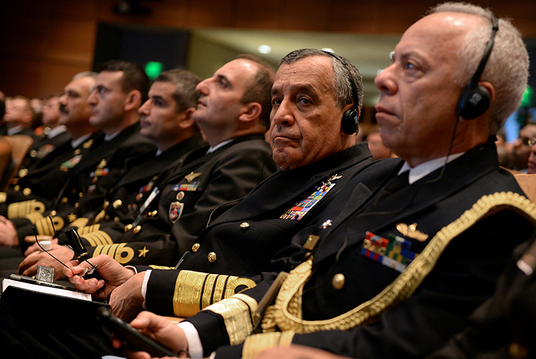 Guests listen to translated remarks through headphones during the Chief of Naval Operations’ 21st International Seapower Symposium (ISS) at U.S. Navy War College in Newport, Rhode Island. 