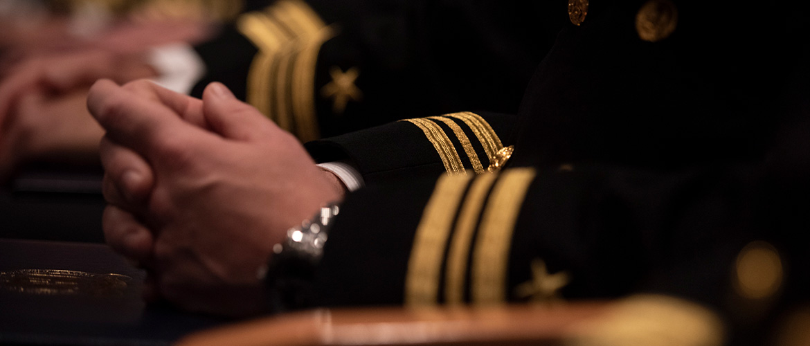 Officer in a group at the U.S. Naval War College.