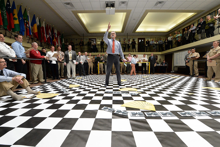 Peter Pellegrino, U.S. Naval War College's (NWC) senior military analyst for wargaming, briefs participants of a wargame reenactment of the Battle of Jutland at NWC in Newport, Rhode Island.