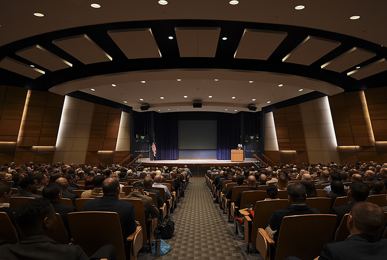 Rear Adm. Jeffrey A. Harley, president, U.S. Naval War College (NWC) in Newport, Rhode Island provides opening remarks during a Pearl Harbor Day evening lecture held at NWC.