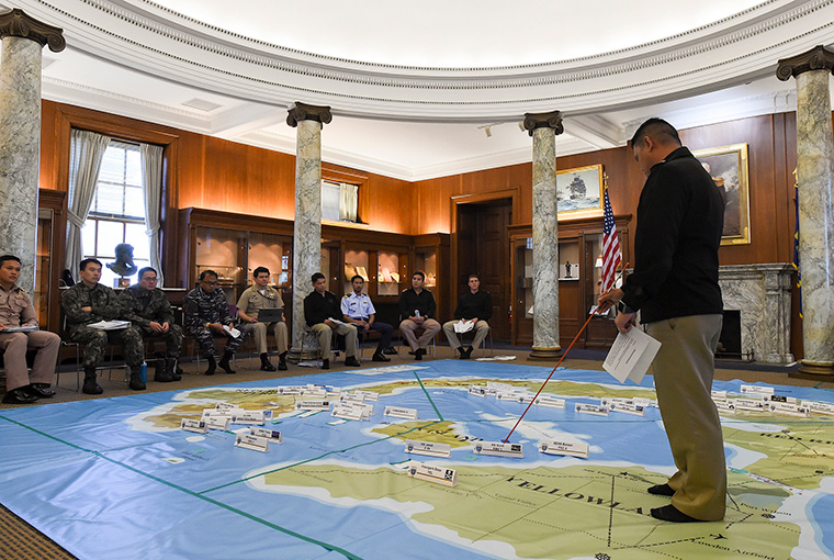 Philippine navy Lt. Arther Jefferson Layug, a U.S. Naval War College International Maritime Staff Operators Course (IMSOC) student, participates in a “Rehearsal of Concept” drill which refines the operational level plan the IMSOC students have developed in response to a fictitious scenario.