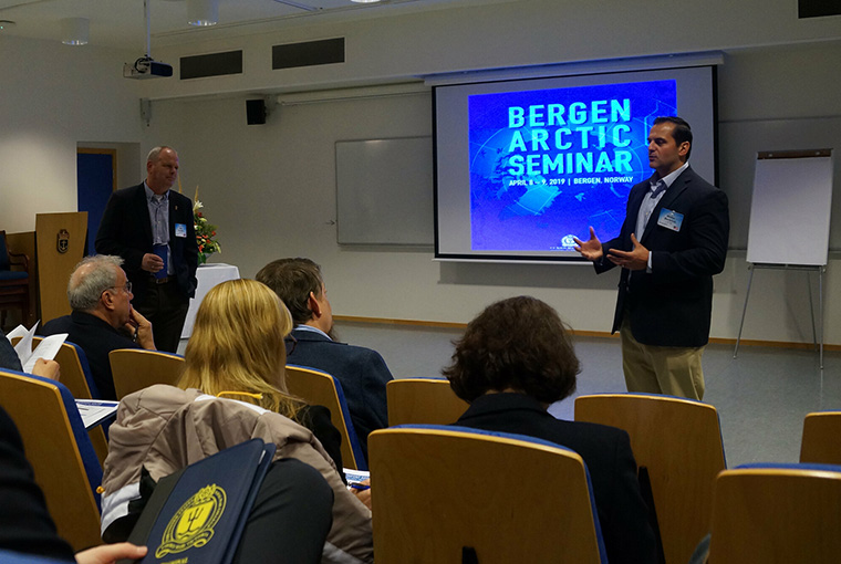 Professors Lars Saunes (left), former chief of Royal Norwegian Navy, and Walter Berbrick (right), co-lead scholars for the Newport Arctic Scholars Initiative discuss important arctic issues at the final NASI symposium held in Bergen, Norway, April 8-9, 2019. 