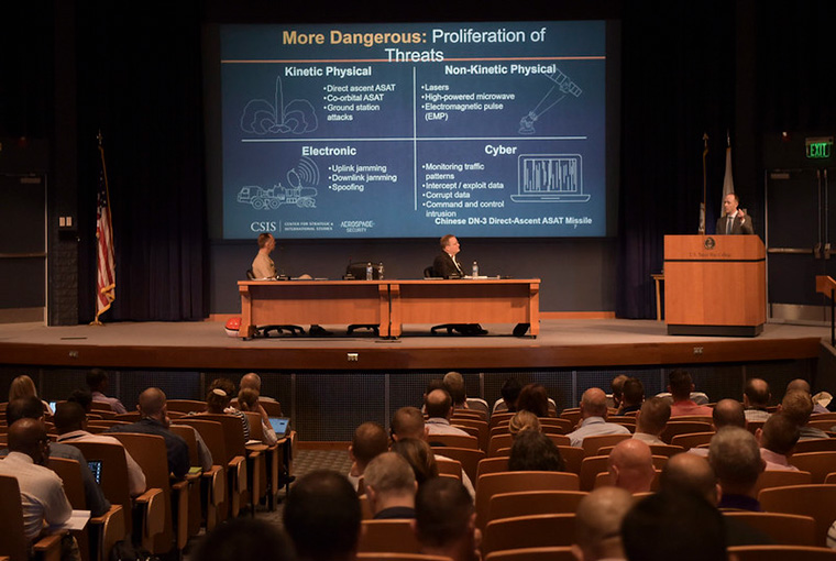 Todd Harrison speaks to U.S. Naval War College students during the panel “Milspace Operation and Organization” during the Future Warfighting Symposium held in the college's Spruance Auditorium, Aug. 8.