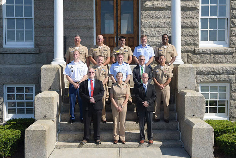Rear Adm. Shoshana S. Chatfield (front row, center), president, U.S. Naval War College,     stands with faculty and graduates of the college’s Advanced Strategist Program on the steps of Luce Hall, Aug. 15