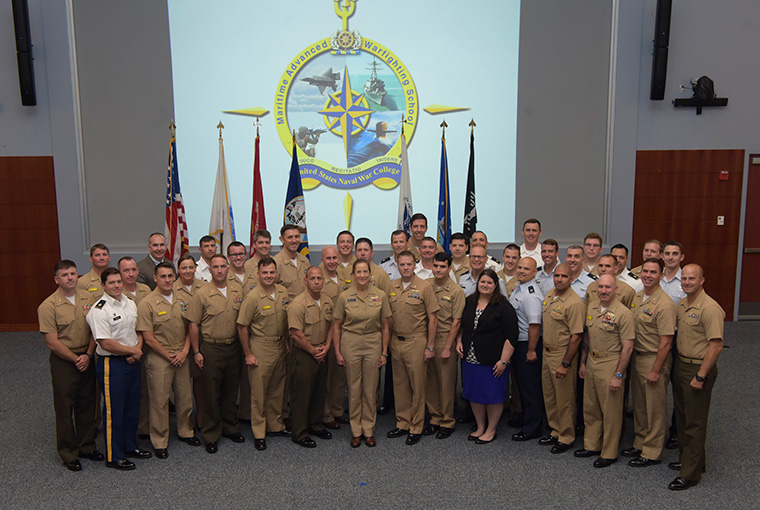 U.S. Naval War College’s Maritime Advanced Warfighting School (MAWS) 2019 graduating class gathers for a group photo at the conclusion of the graduation ceremony.