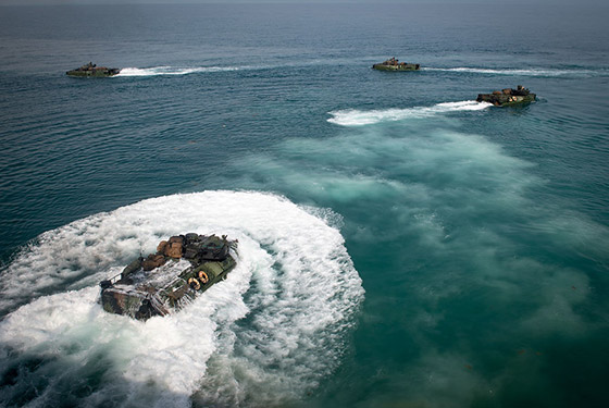Amphibious assault vehicles launch from the well deck of the amphibious dock landing ship USS Oak Hill (LSD 51) during well deck operations, Feb. 23, 2020.